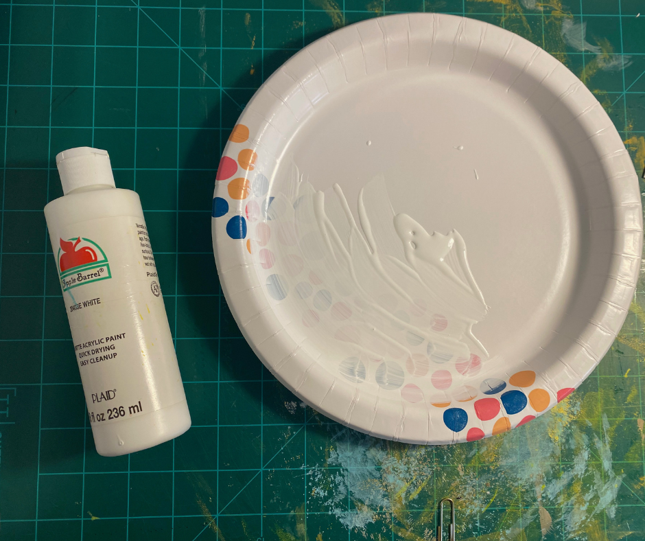 paper plate with white paint on it