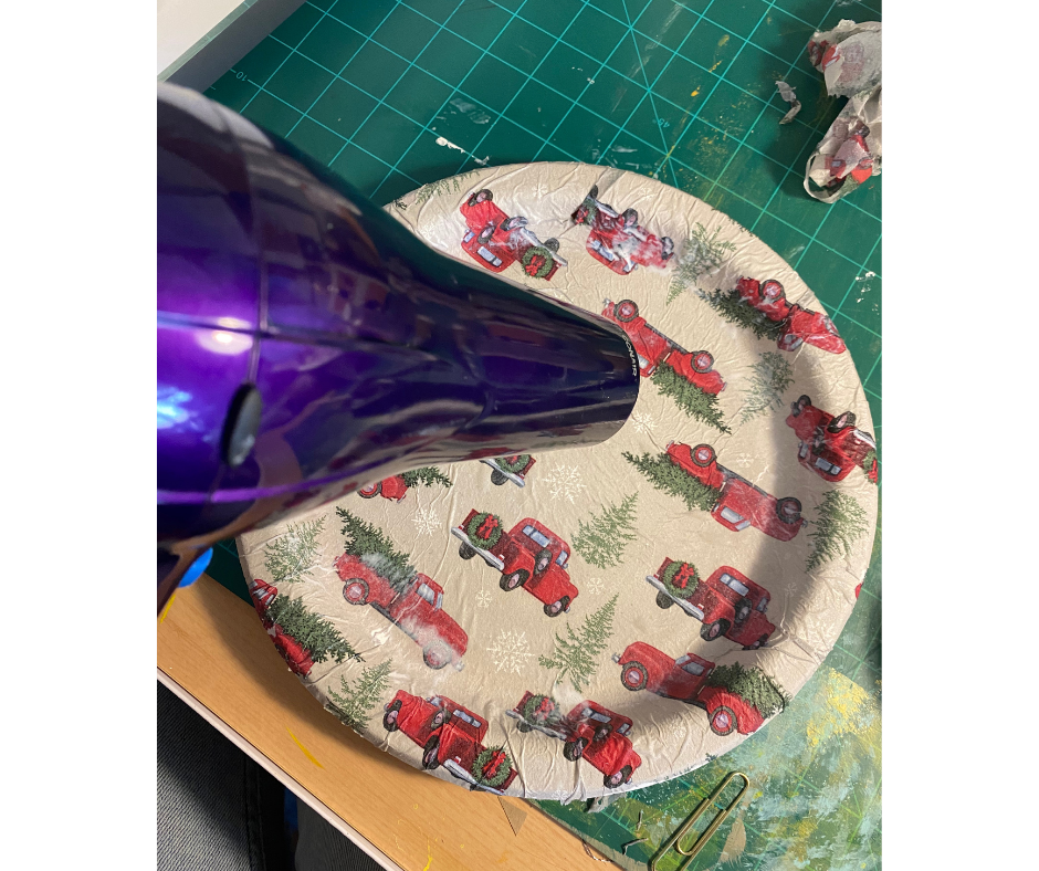 hair dryer drying mod podge on plate