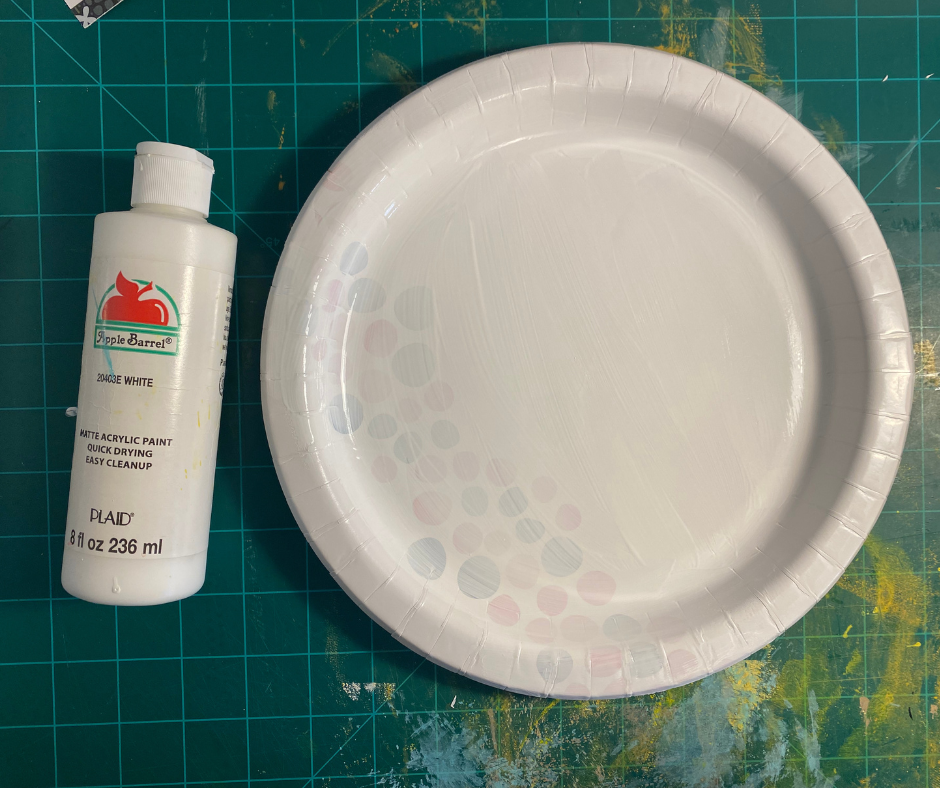 paper plate with dried white paint on it